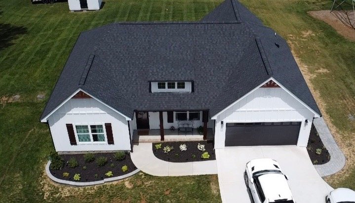 M1 Roofing Group — Modern home aerial roof view Charlotte NC
